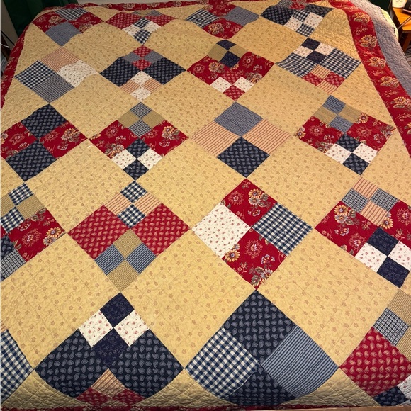 Patchwork Quilt with Red Blue and Cream Design
